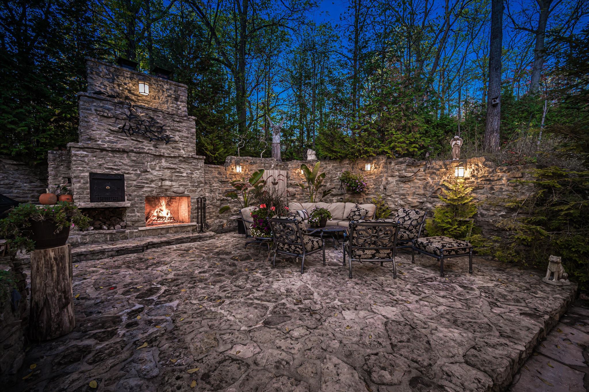 Stone courtyard with outdoor fireplace